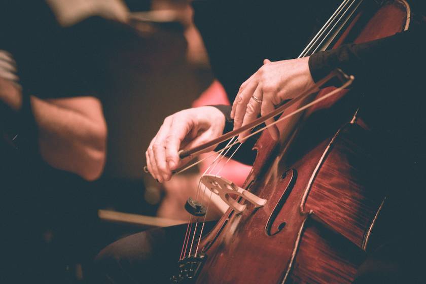 Close up of person playing a cello