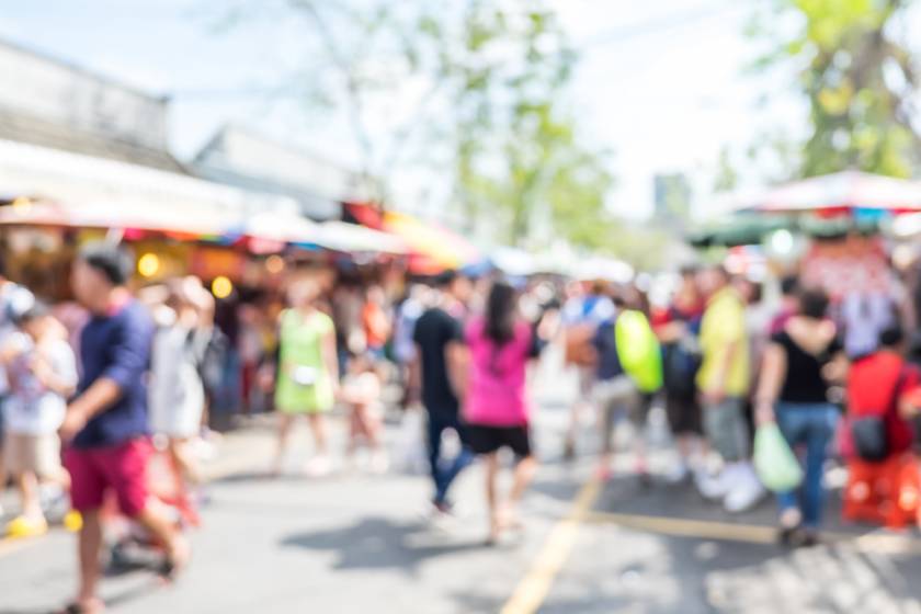 Blurry street market with people walking